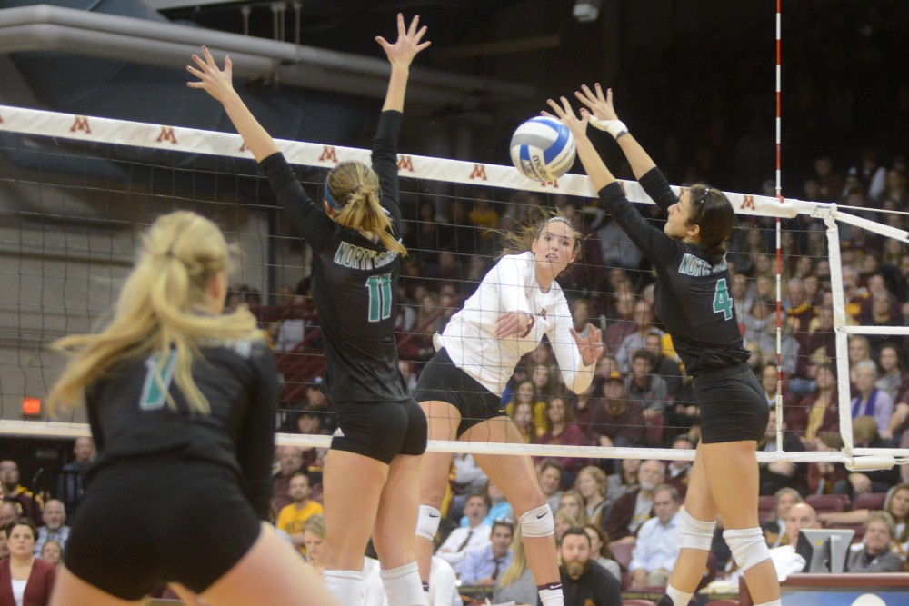 Senior outside hitter Sarah Wilhite spikes the ball on Friday, Dec. 2, 2016 at the Sports Pavilion. The Gophers won against the University of North Dakota.