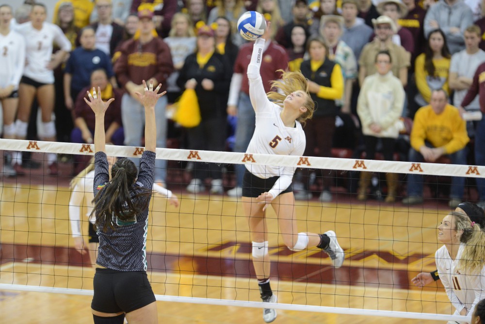 Junior outside hitter Alyssa Goehner spikes the ball on Saturday, Dec. 3, 2016 at the Sports Pavilion. The Gophers won against the University of Hawaii.