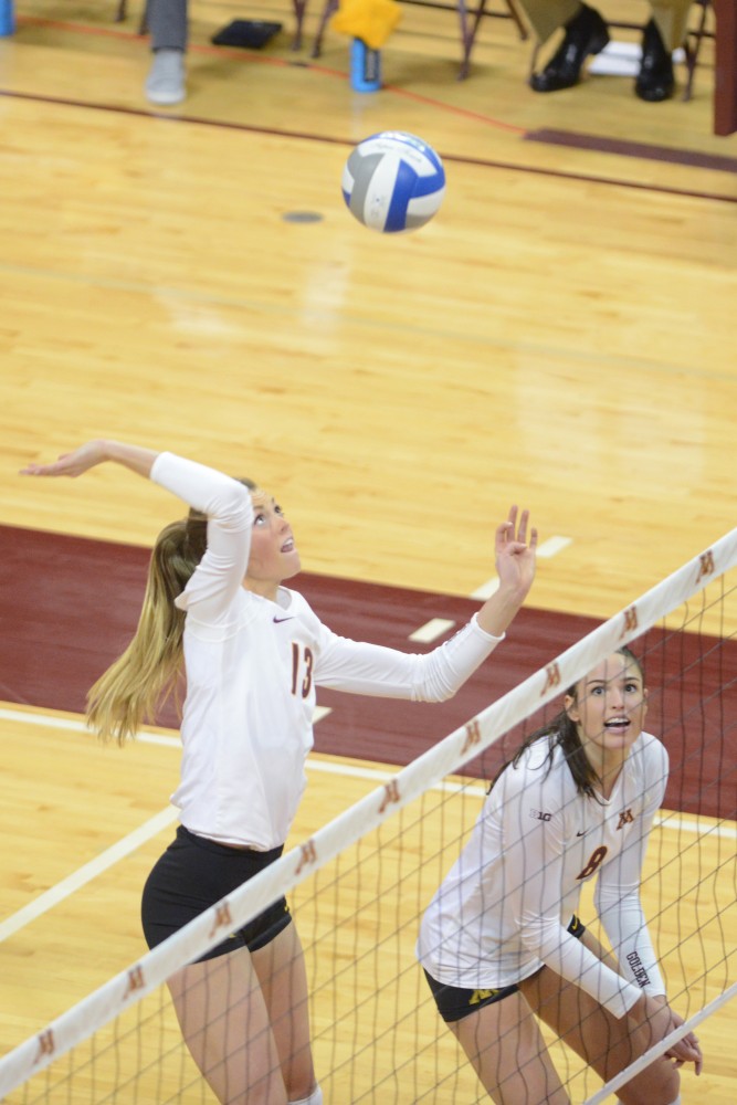 Junior middle blocker Molly Lohman spikes the ball on Saturday, December 3. 2016 at the Sports Pavilion. The Gophers won against the University of Hawaii.