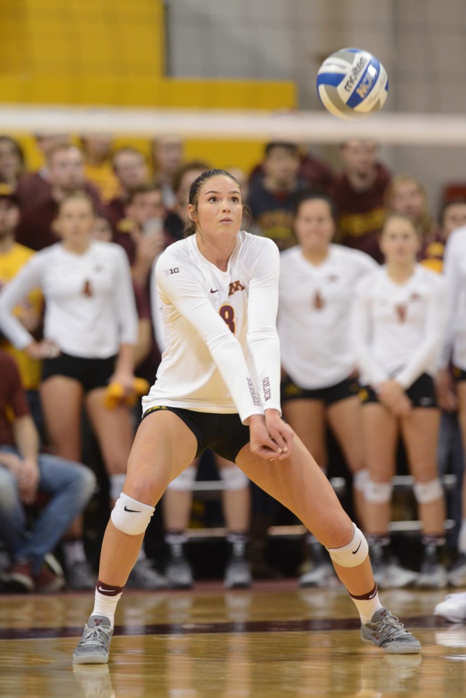 Senior outside hitter Sarah Wilhite sets the ball on Saturday, December 3. 2016 at the Sports Pavilion. The Gophers won against the University of Hawaii.