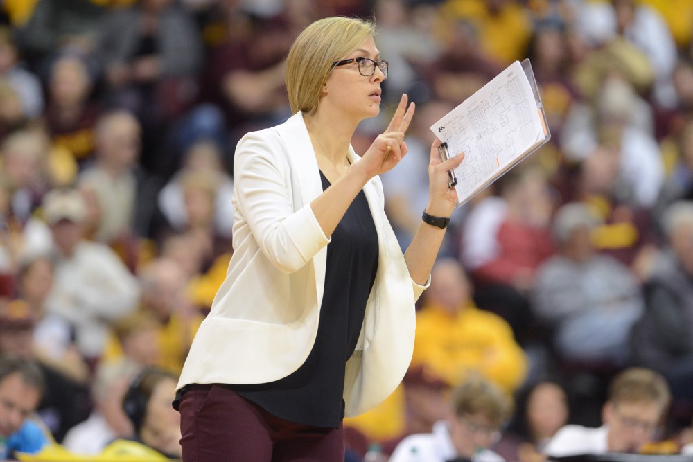 Assistant Coach Laura Kasey signals to the gophers on Saturday, December 3. 2016 at the Sports Pavilion. The Gophers won against the University of Hawaii.