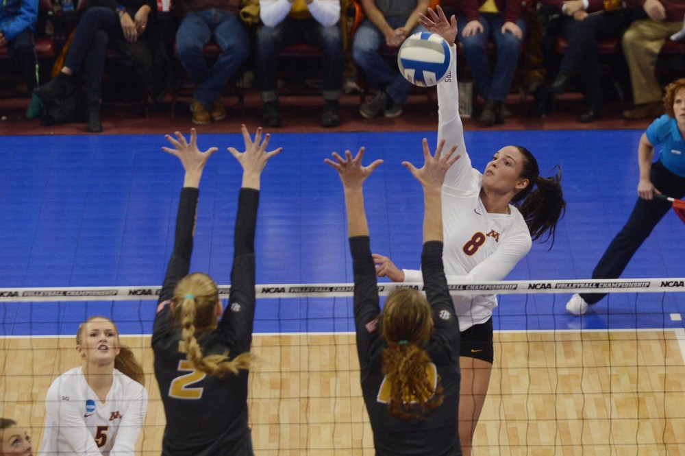 Outside hitter Sarah Wilhite attempts to return the ball to Mizzou on Friday, Dec. 9, 2016 at the Sports Pavilion during the Gophers NCAA Regional semi-final game. 