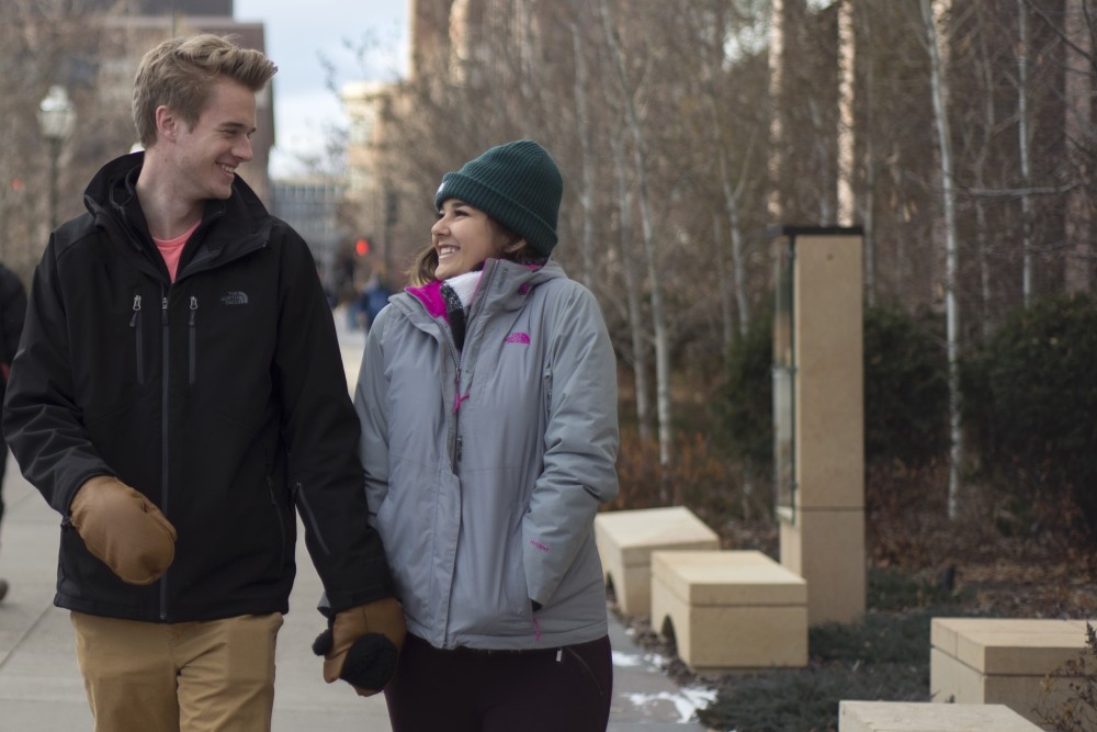 Adam Baker and Grace LaPrairie walk around campus on Friday, December. 9, 2016.