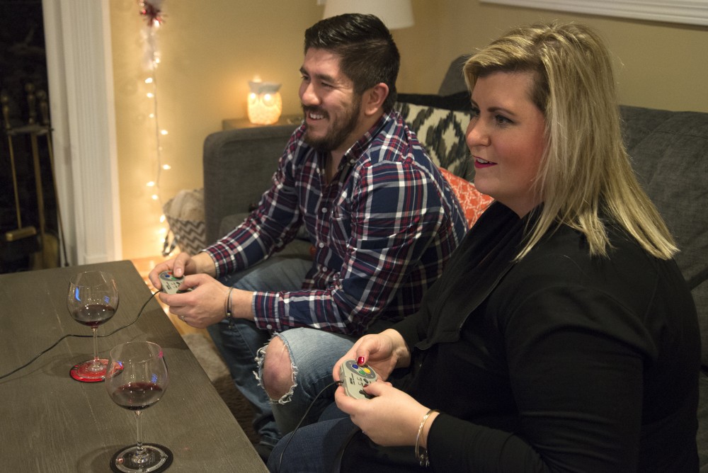Miguel Rocha and wife Mindy play Super Mario together at their home in Apple Valley, Minn. on Friday, December. 9, 2016.
