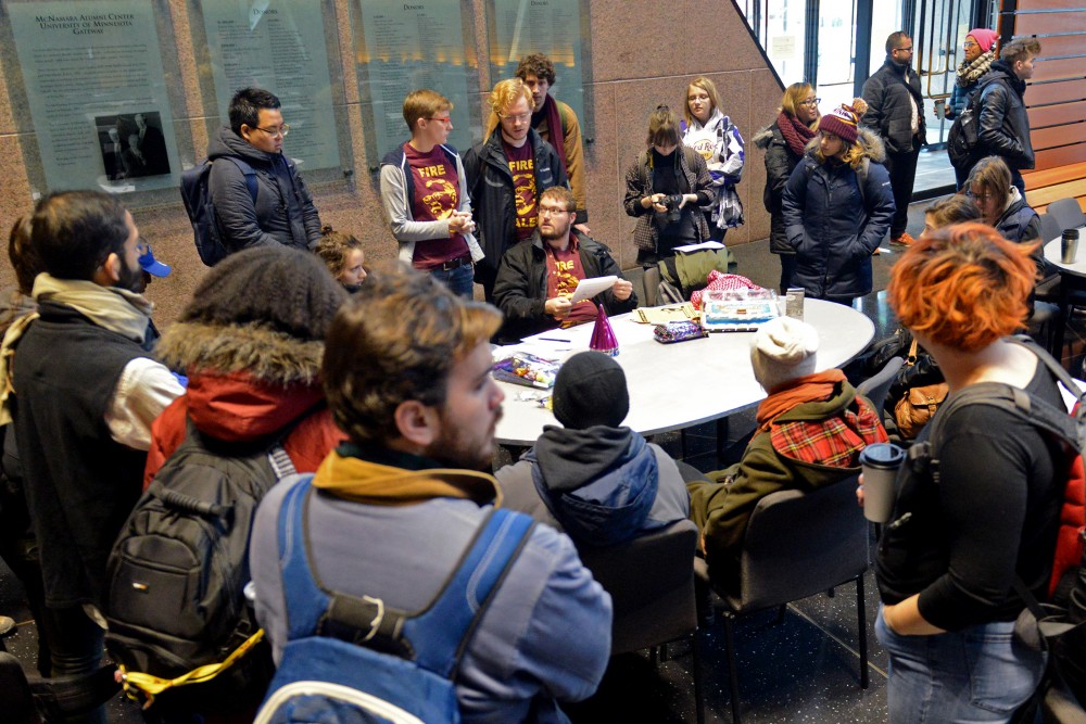 Students for a Democratic Society discuss their plan at McNamara Alumni Center on Friday, Dec. 9, 2016. Students for a Democratic Society protested the Board of Regents meeting.