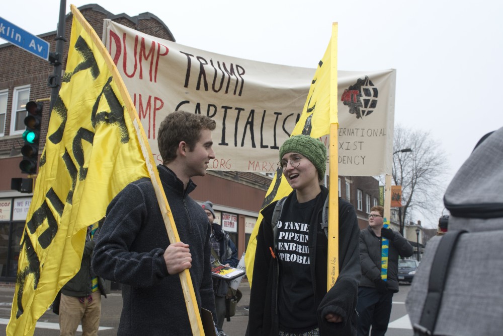 High school students Justin Johnson and Isabel Watson protest the inauguration of Donald Trump on January 20, 2017. It creates a sense of hope, marching in the streets, Watson said. 