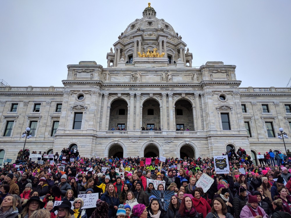 Protesters rally on the stairs of the state capital in St. Paul on Saturday, Jan 21. Protesters marched in solidarity with women across the nation.