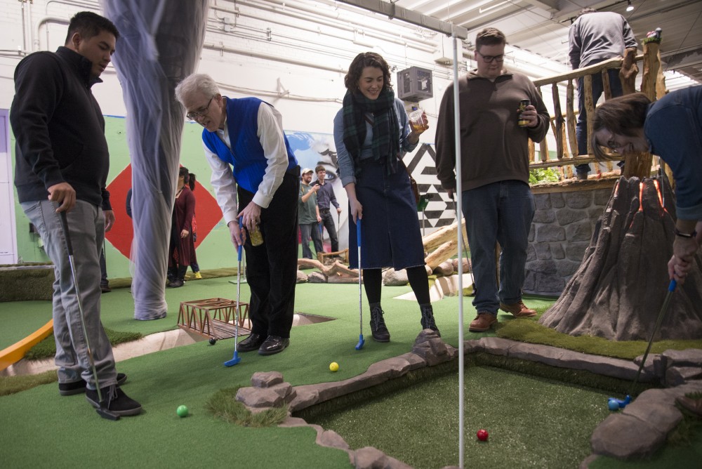 Golfers take turns putting at Hole 3: Natural Disaster at Can Can Wonderland in St.Paul on Thursday, Jan 16.