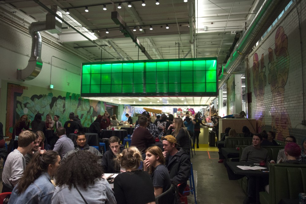 Friends enjoy food and drinks at Can Can Wonderland in St.Paul on Thursday, Jan 16.