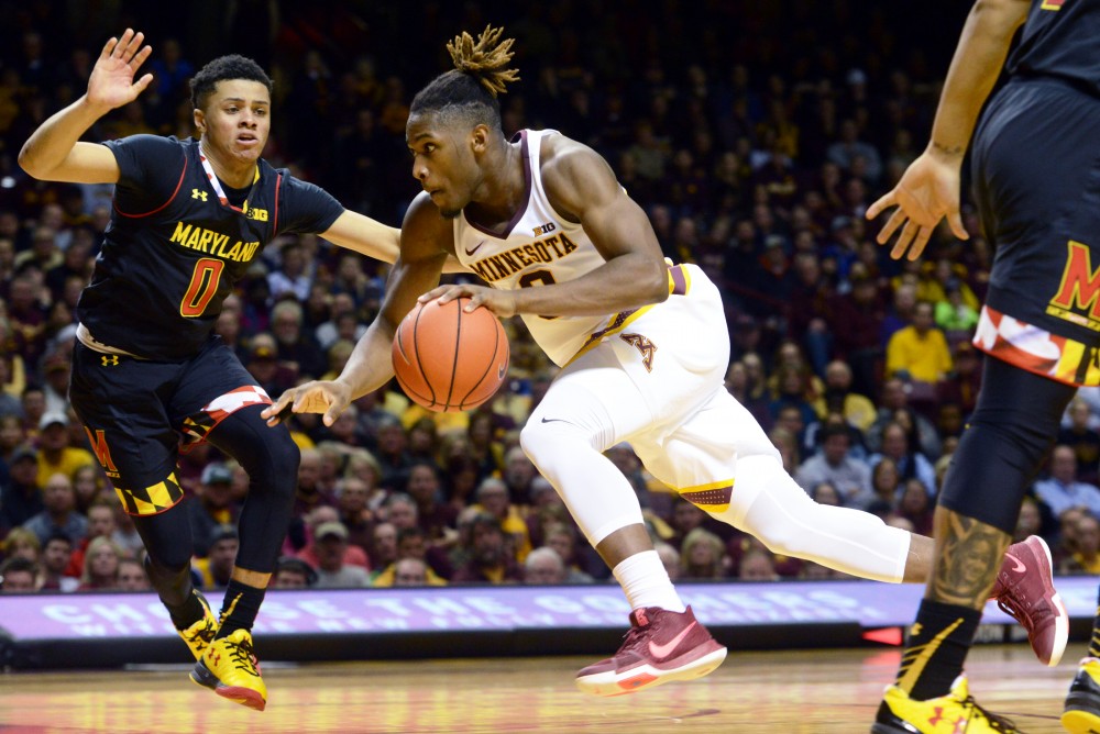 Grad student Akeem Springs drives the ball up the court on Saturday, Jan. 28, at the Sports Pavilion. The Gophers lost 78-85 against the University of Maryland Terrapins.