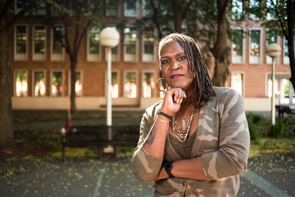 Andrea Jenkins, a former Minneapolis city council policy aide and Transgender Oral History Project curator, poses for a portrait outside Blegen Hall on the West Bank campus, June 2. 