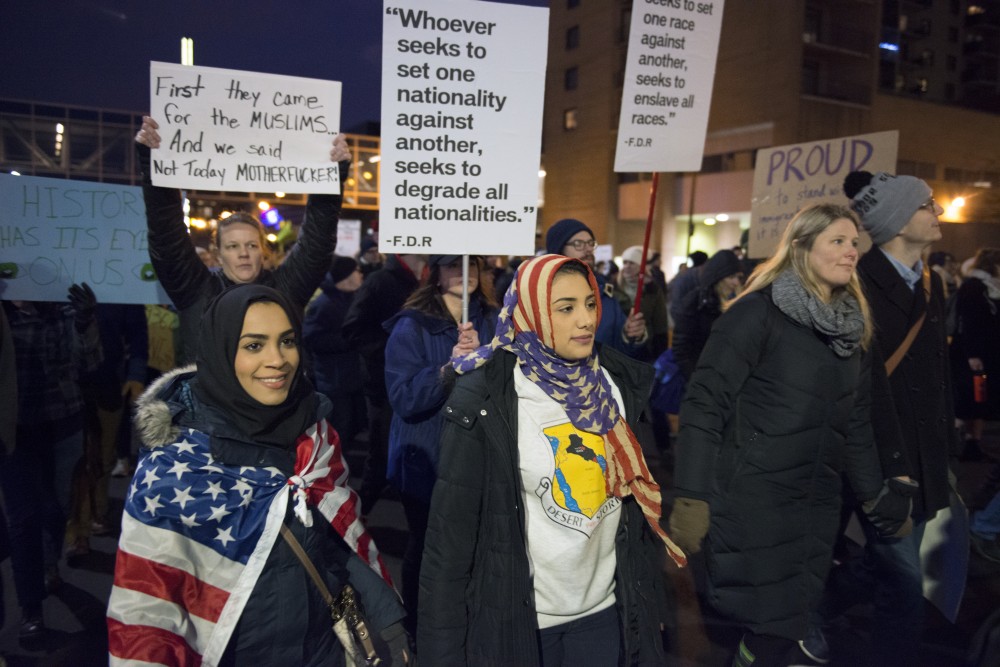 Iraqi refugees Hawra Albattat and Saja Alnabi march through downtown Minneapolis to protest President Donald Trumps immigration ban on Tuesday, Jan. 31, 2017. We cant go home and see our family now, Albattat said. 