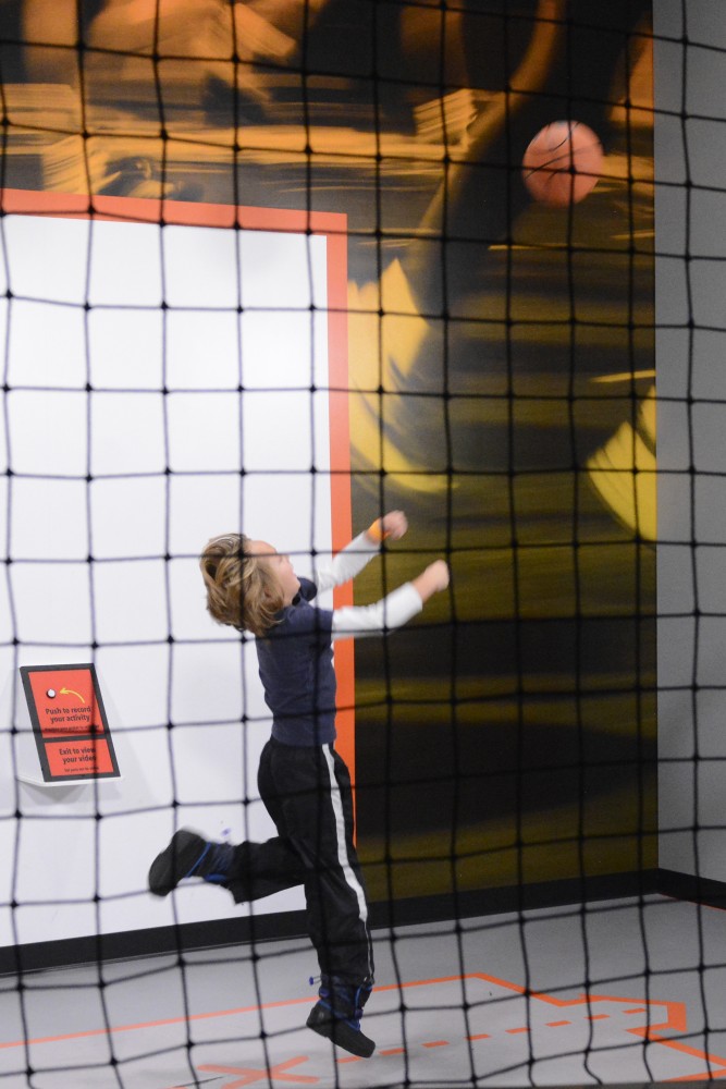 Henry Guttormson, 7, tries out the Motion Lab at the Sportsology exhibit at the Science Museum of Minnesota in St. Paul on Jan. 27, 2017. The Motion Lab lets kids compare a video of their sports skills with a professional or collegiate athlete, such as Gophers volleyball player Paige Tapp.
