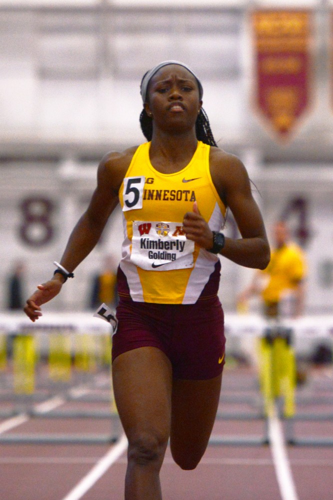 Kimberly Golding continues running after winning the Womens hurdle event at the Field House on Jan. 23, 2016.