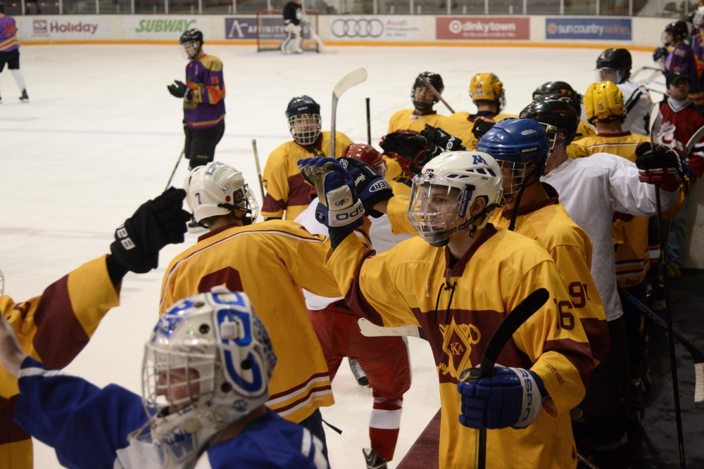 Pi Kappa Alphas team celebrates a goal in the final of the Lakes and Legends hockey tournament on Saturday, Feb. 4, 2017 at Ridder Arena. 
