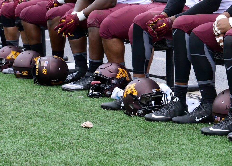 Gophers football players sit on the sidelines during a game at TCF Bank Stadium on Oct. 3, 2015. 