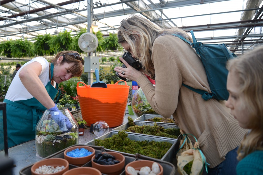 Shannon Svensrude takes photos during a demonstration on planting terrariums on Saturday, Feb. 18, 2017 at the Tonkadale Greenhouse in Minnetonka, MN.  