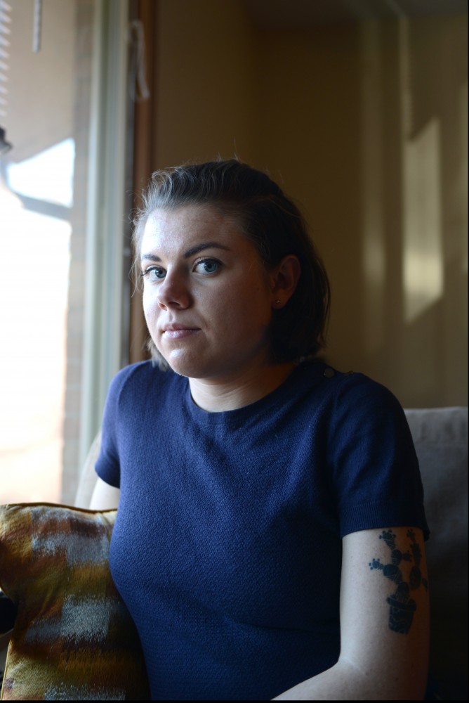 Maria poses for a portrait in her apartment on Feb. 14, 2017. She came forward to share her story of being assaulted by a member of Delta Upsilon. 