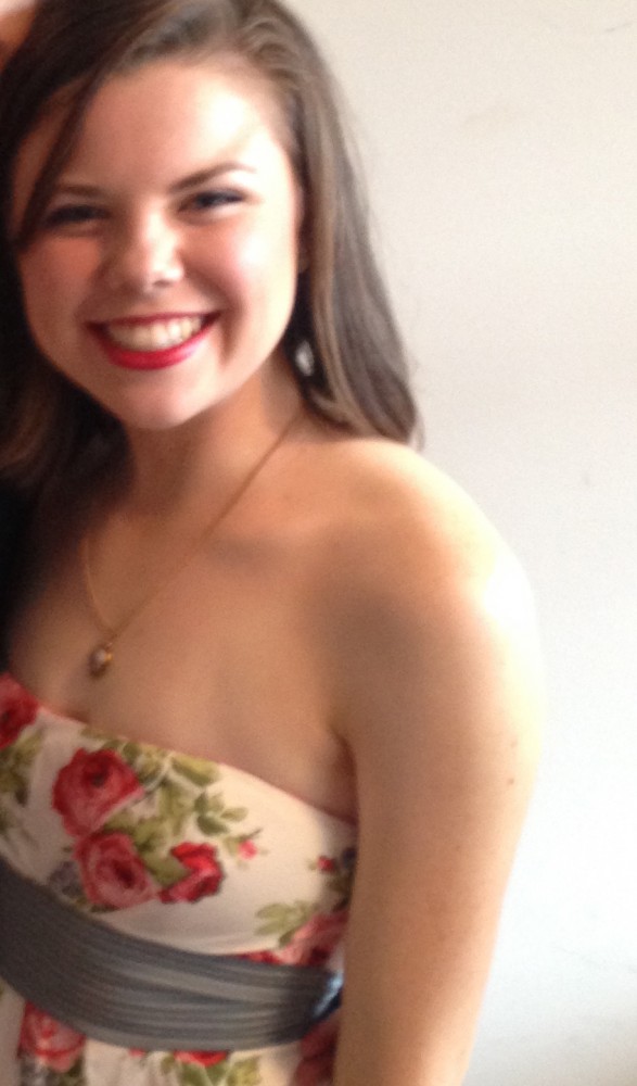Maria poses for a photograph before a sorority formal in spring 2015. After the formal, she changed into shorts and a tank top and went to an after-party at Delta Upsilon, where she was sexually assaulted. 