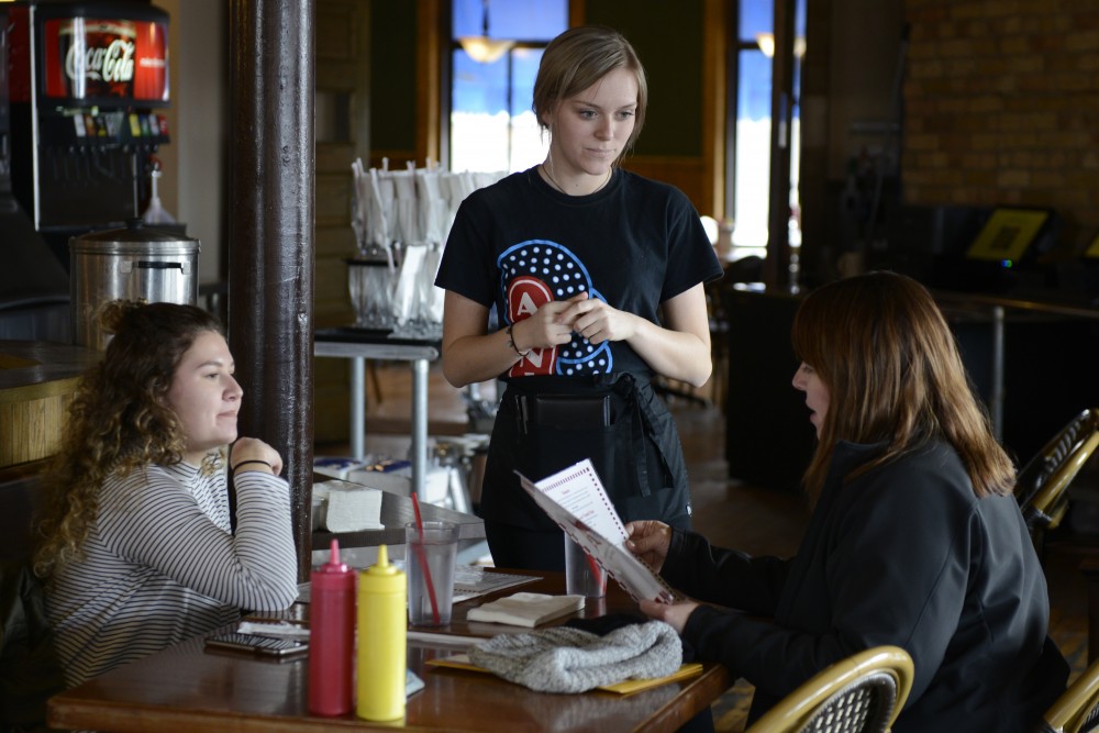 Andrea Fenno takes orders from Kathy and Emmy Byers at Annies Parlour on Monday, February 27, 2017 in Dinkytown.