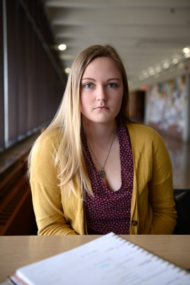 Haleigh Ortmeier-Clarke poses for a portrait in Magrath Library on the St. Paul Campus on Feb. 23, 2017. Ortmeier-Clarke came forward to share her story of sexual assault. 