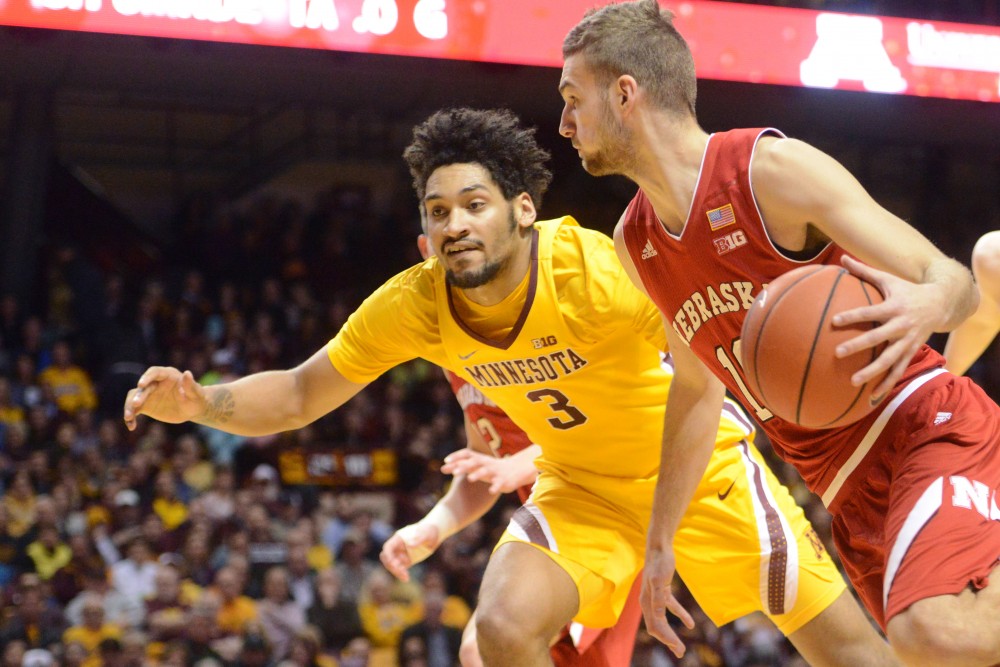 Sophomore forward Jordan Murphy and freshman forward Michael Hurt look to defend against the Cornhuskers offense at Williams Arena on Thursday, Mar. 2, 2016. The Gophers won against the University of Nebraska Cornhuskers 88-73, the eighth win in a row.
