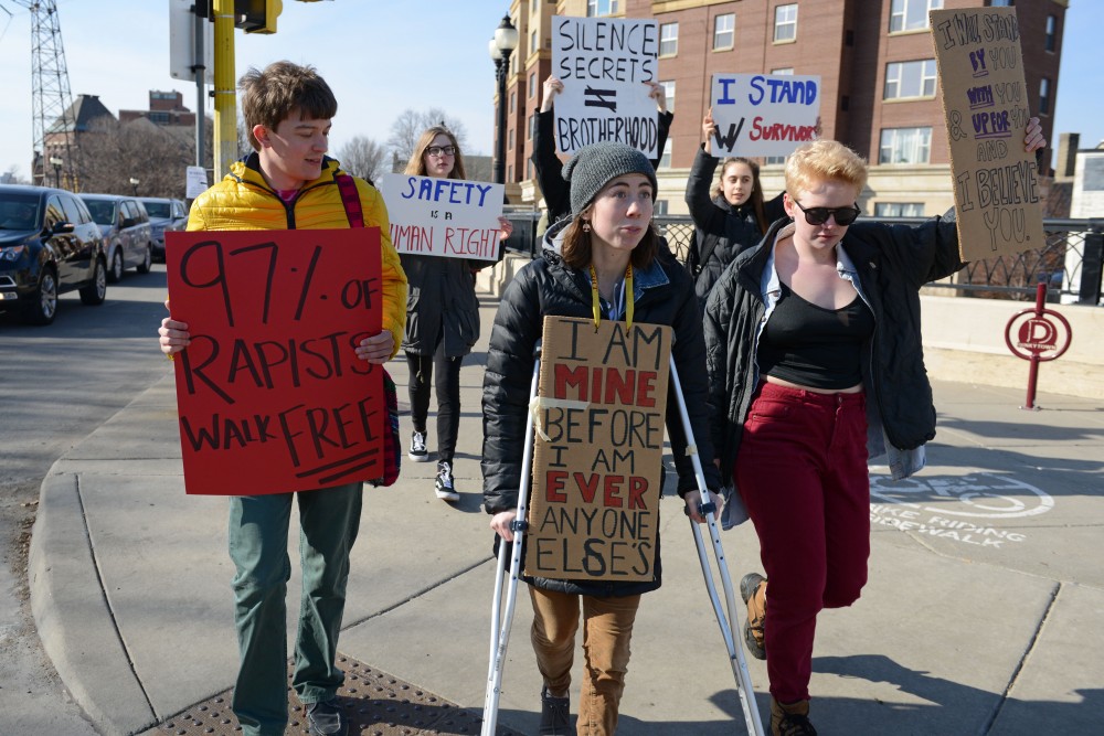 Sexual assault survivors, advocates and fraternity members marched as part of a protest along frat row organized by Break the Silence Day on Saturday, Mar. 4, 2017.