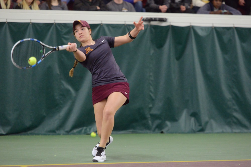 Sophomore Caitlyn Merzbacher returns the ball at Baseline Tennis Center on Saturday, Mar. 4, 2017. The Gophers played against the University of Wisconsin.