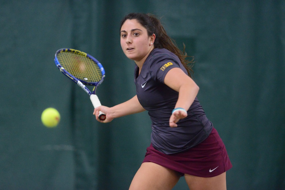 Sophomore AnneMarie Emme returns the ball at Baseline Tennis Center on Saturday, Mar. 4, 2017. The Gophers played against the University of Wisconsin.