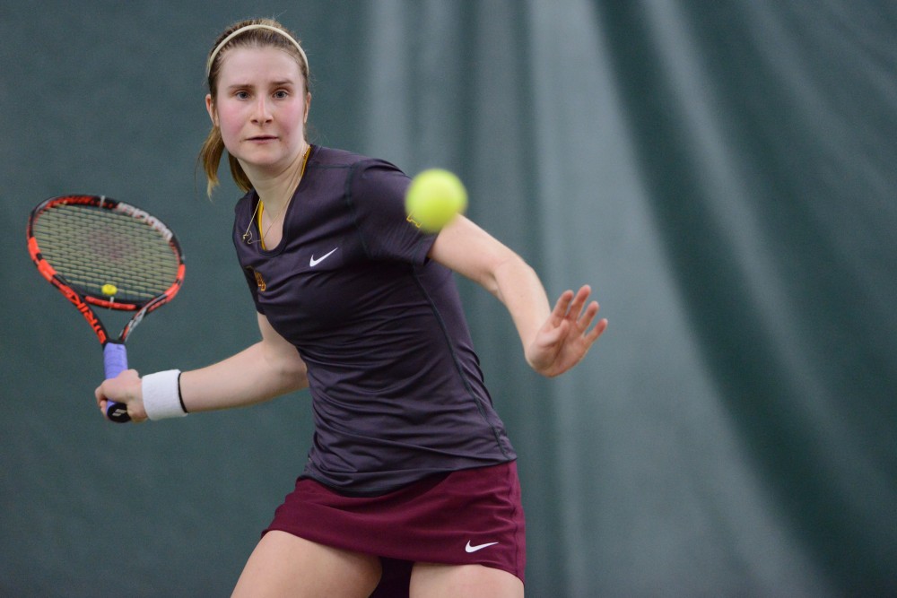 Junior Caroline Ryba looks to return the ball at Baseline Tennis Center on Saturday, Mar. 4, 2017. The Gophers played against the University of Wisconsin.