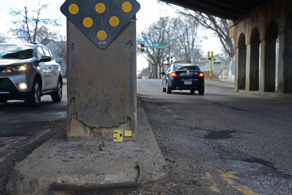 A mouse door sits under a railroad bridge on Broadway St. NE in Minneapolis. A local street artist Mows installs mouse doors around Minneapolis. 