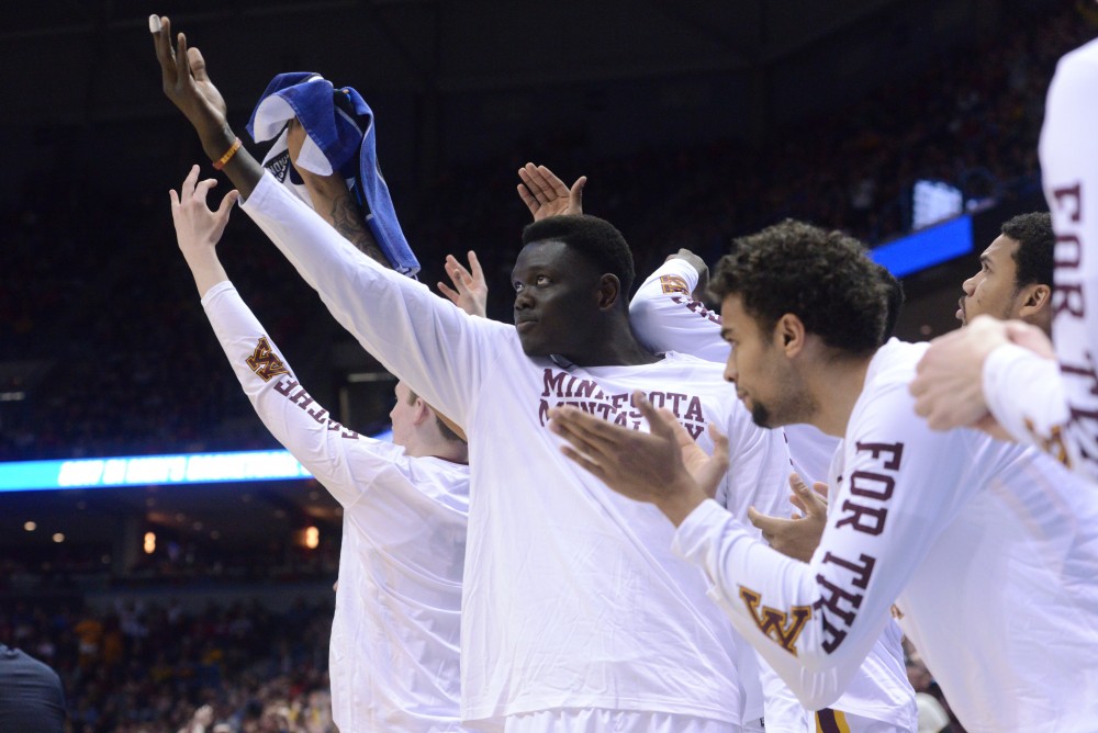 Junior forward Gaston Diedhiou cheers for the Gophers on Thursday, Mar. 16, 2017 in Milwaukee at the Bradley Center. The Gophers lost 81-72 to the Middle Tennessee Blue Raiders.