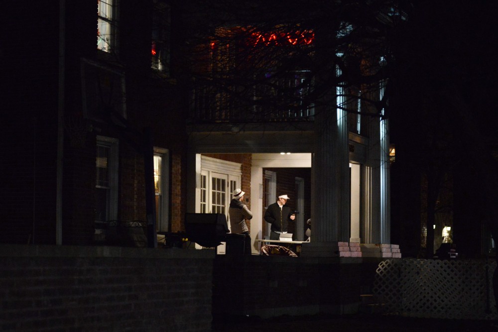 A group of men stand outside of the Phi Kappa Psi house on Fraternity Row on March 10, 2017. At the house, sexual assault is addressed at least once a month by members during chapter meetings. 