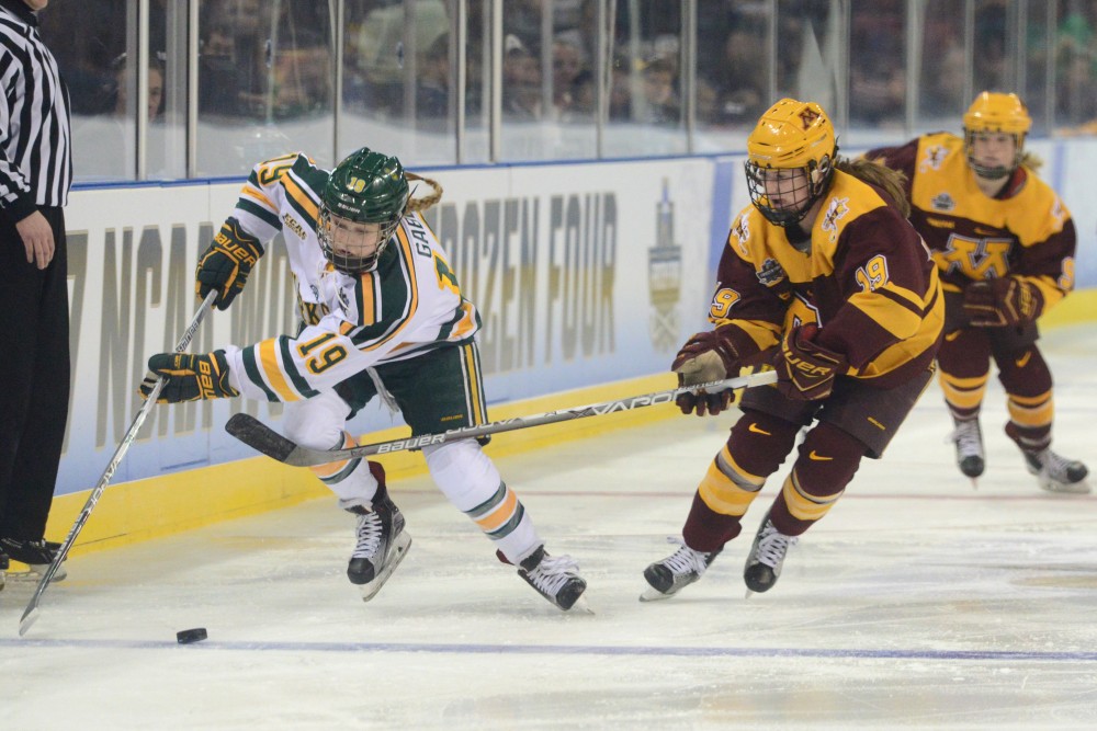 Sophomore forward Loren Gabel handles the puck on Friday, Mar. 17, 2017 in St. Charles, Missouri. The Gophers lost 4-3 against Clarkson University Golden Knights.