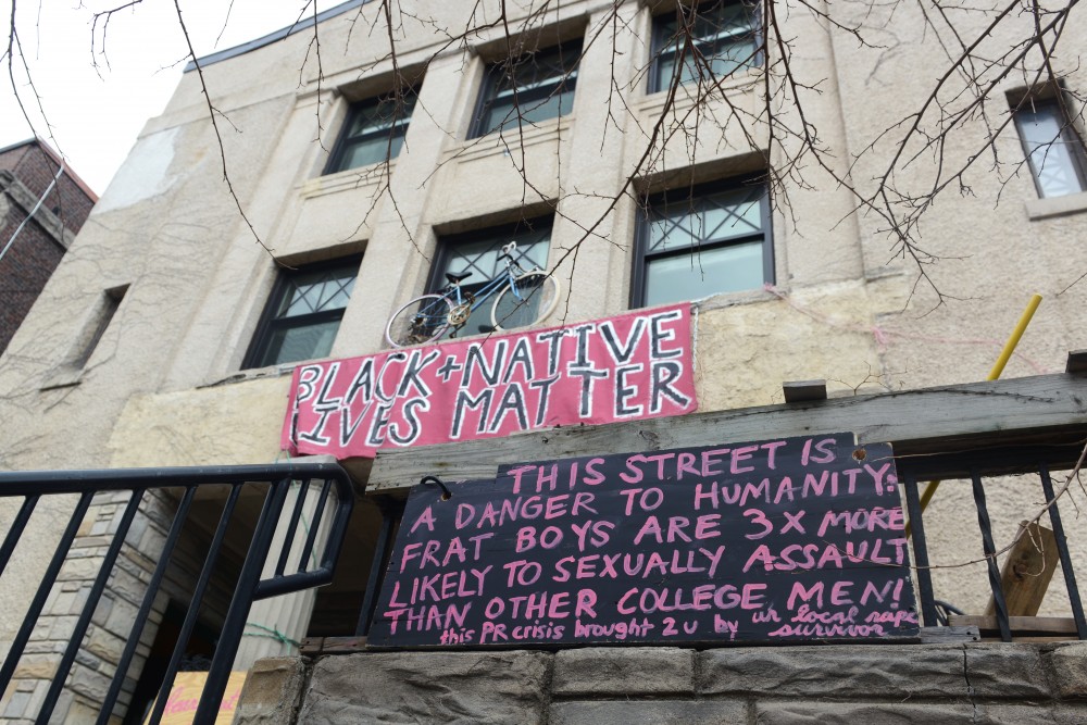 Hand painted signs sit in-front of the Students Co-Op on Monday, March 20, 2017. Members of the greek community are frustrated with the tone and content of the signs. 