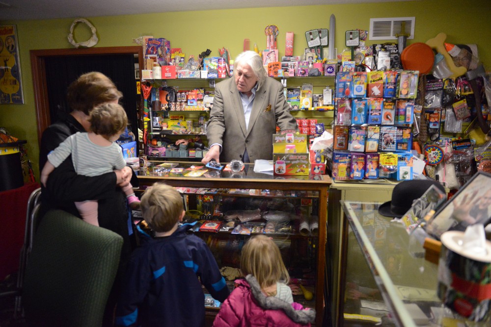 Larry Kahlow shows a boy different gag gifts to give out at his birthday party in Eagle Magic and Joke Store on Friday, March 24, 2017.