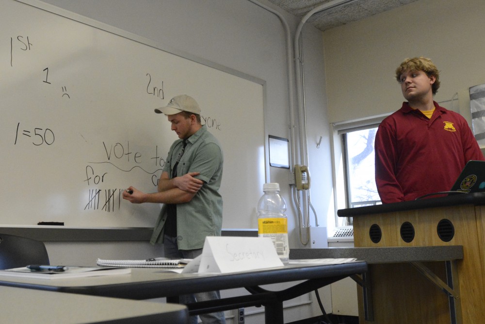 French junior Quin Klett and Genetics, Cell Biology, and Development junior Nick Malcore tally votes during the role-playing game Reacting to the Past in Gateways to French and Francophone Studies class in Peik Hall on Tuesday, March 28, 2017. Every student plays a historical role affiliated with the National Assembly during the French Revolution. Its a fun way to learn and internalize information in a different manner, Klett said. Course book readings go over your head but you have to know what youre talking about here. 