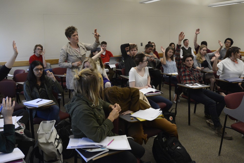 Professor Juliette Cherbuliez counts votes during the role-playing game Reacting to the Past in Gateways to French and Francophone Studies class in Peik Hall on Tuesday, March 28, 2017. Every student plays a historical role affiliated with the National Assembly during the French Revolution. 