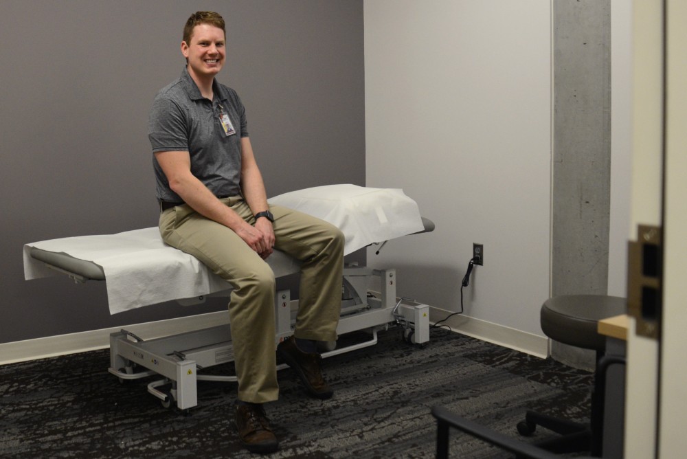 Therapist Joseph Schoess poses for a portrait inside the new physical therapy room at the University Recreation and Wellness Center on Tuesday, April 4, 2017.