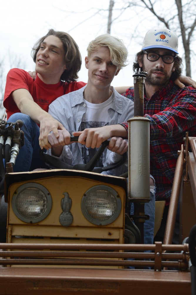 Members of Remo Drive, Erik Paulson, Stephen Paulson and Sam Mathys, pose for a portrait in the backyard of their practice space on Thursday, March 30, 2017 in Bloomington. 