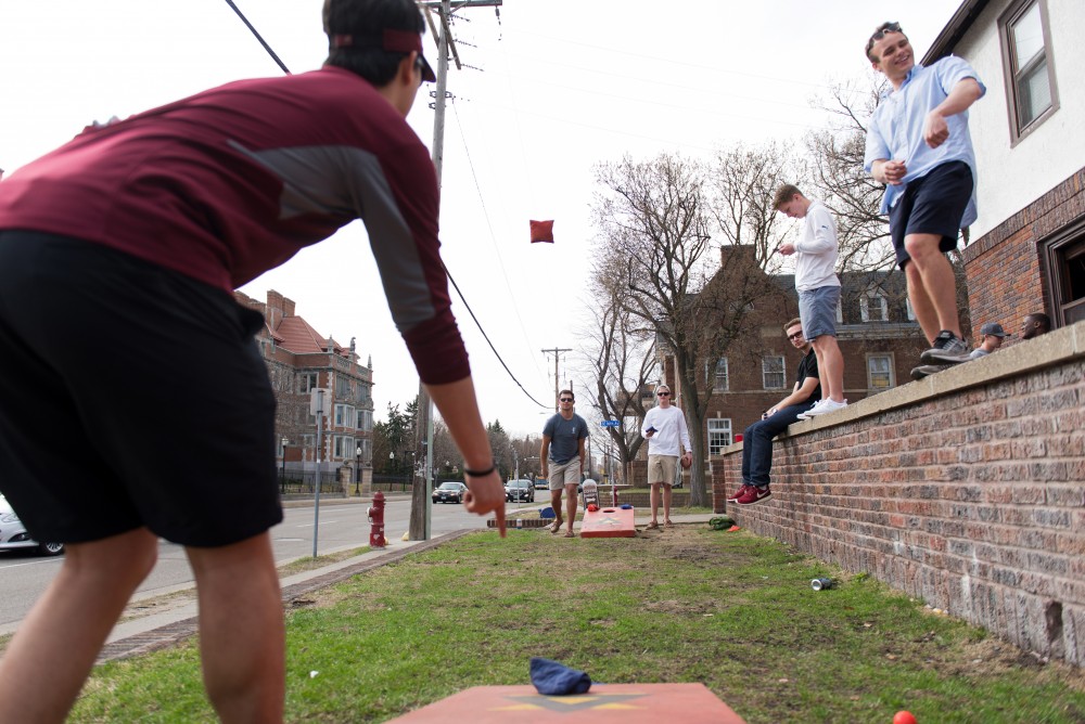 Will Fotopoulos scores in a round of beanbags outside Delta Chi on April 7, 2017.