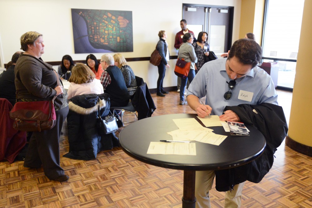 Staff member Ralph Blanco fills out a feedback form at the University Community Conversation in Coffman Memorial Union on Tuesday, April 11, 2017. Blanco said hes interested in the Immigration Response Teams vision and goals. 