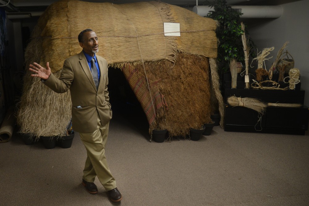 Osman Mohamed Ali stands in front of a traditional nomad somali hut and homestead at the Somali Museum of Minnesota on Friday, April 14, 2017 in Minneapolis.