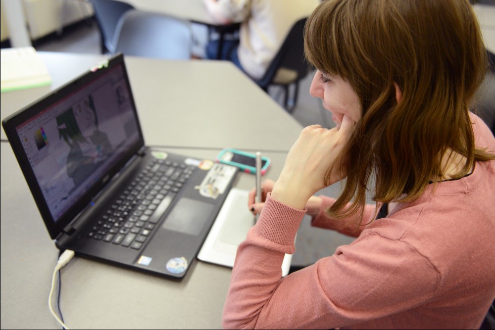 Special education junior Autumn Wetzel draws animations before intermediate poetry class on Wednesday, April 12, 2017. Wetzel is registered with the University Disability Resource Center for their mental and math disabilities. They said that drawing during class helps stabilize their mood and keep them focused. 