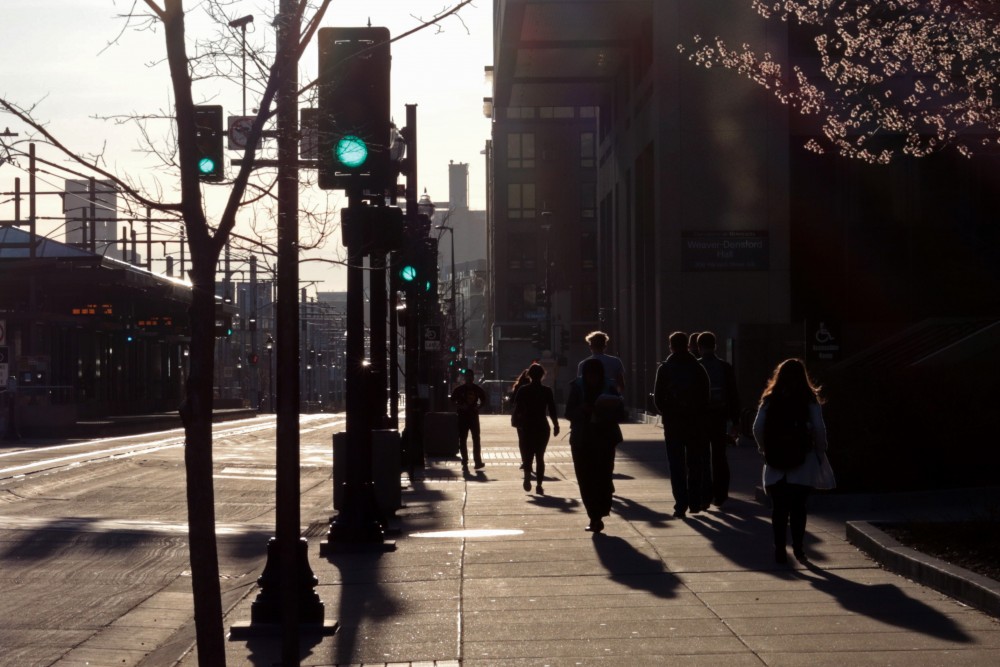 Pedestrians walk down Washington Avenue.