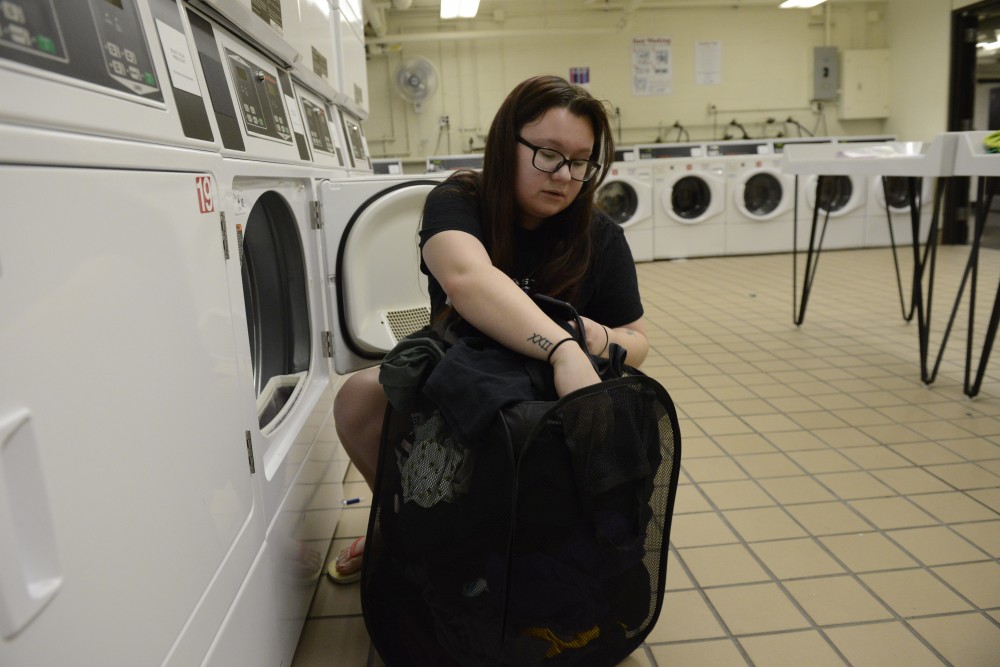 Briauna Baltzell does laundry in Comstock Hall. 
