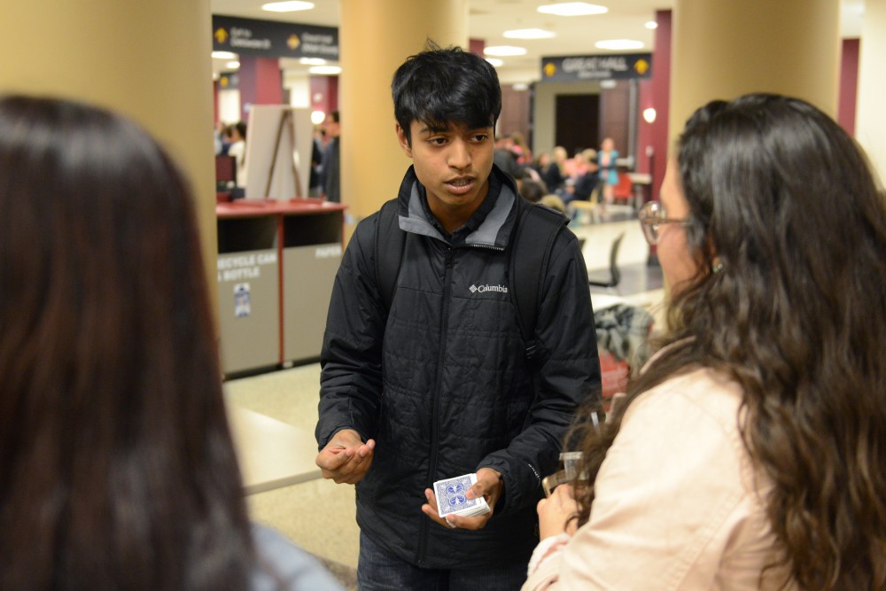 Computer Science freshman Arman Shah performs a magic trick in Coffman Memorial Union on Thursday, April 27, 2017. Shah has been performing for 7 years after teaching himself on YouTube. 