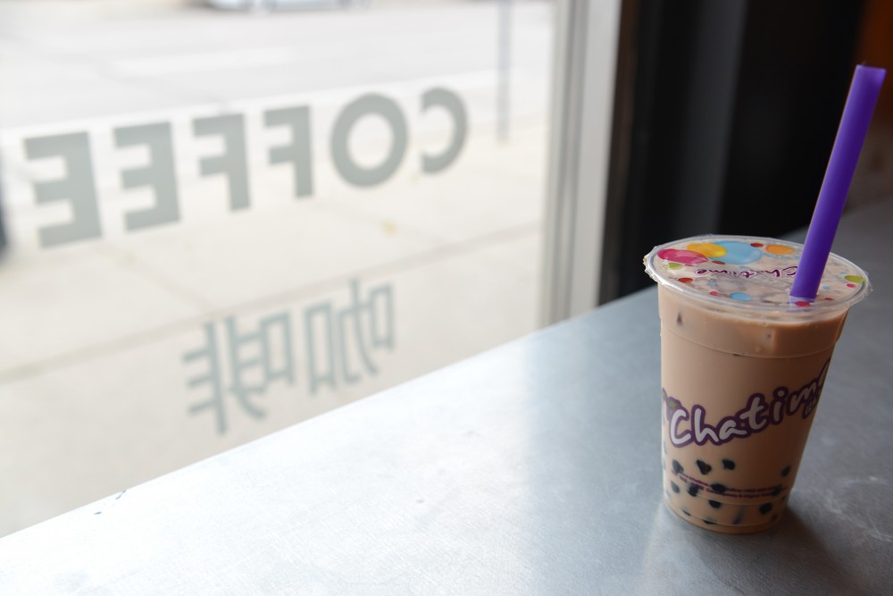 Milk tea with bubbles on Tuesday, May 30. from Chatime sits on a table inside Chatime.