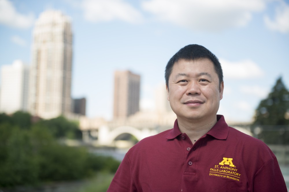 Lian Shen poses for a portrait outside the St. Anthony Falls Laboratory on Monday, June 26. The former professor in the Department of Mechanical Engineering will start as the labs new director Sep. 1.