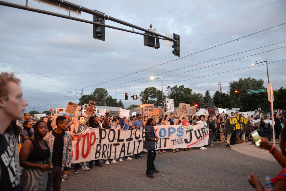 Protestors march on University Avenue in St. Paul on Friday, June 16.